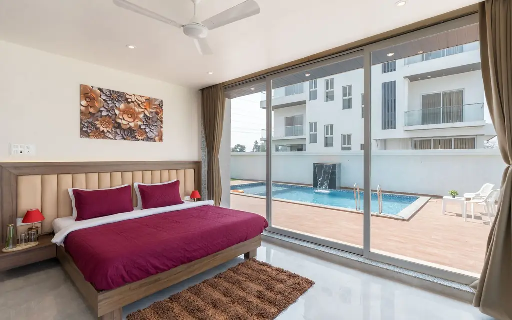 Hotel suite opening onto a pool